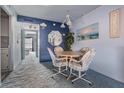Cozy dining area with round table and four chairs at 12760 Indian Rocks Rd # 582, Largo, FL 33774