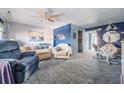 Relaxing living room has comfortable seating and nautical themed decorations at 12760 Indian Rocks Rd # 582, Largo, FL 33774