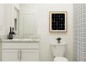 Clean bathroom with white cabinets and granite countertop at 13624 Newbridge St, Spring Hill, FL 34609