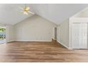 Bright living room featuring hardwood floors and access to other rooms at 14905 Pelican Point Pl, Tampa, FL 33625