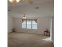 Bright living room with neutral carpeting and lots of natural light at 1760 Dorothy Blvd, Lutz, FL 33558