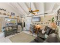 Bright living room featuring vaulted ceiling and relaxing seating at 1808 Gulf Blvd # 1, Indian Rocks Beach, FL 33785