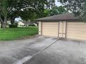 Two-car garage with a spacious driveway at 3259 Hilary Cir # 1A, Palm Harbor, FL 34684