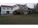 House with attached garage, spacious yard, and driveway at 13621 Mcintosh Rd, Thonotosassa, FL 33592
