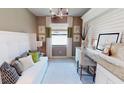 Home office with built-in desk and window seat at 10741 Buttercup Ct, Venice, FL 34293