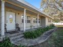 Covered front porch with white columns and entryway at 1601 Lakeview Rd, Clearwater, FL 33756