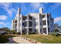 Three-story residential building with waterfront access at 3127 W Sligh Ave # 203B, Tampa, FL 33614