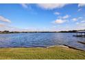 Scenic waterfront view with calm water and lush greenery at 3127 W Sligh Ave # 203B, Tampa, FL 33614