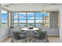 Bright dining area with water views and seating for four at 5108 Brittany S Dr # 506, St Petersburg, FL 33715