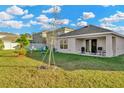 Spacious backyard with patio and grassy area at 1663 Hazy Sea Dr, Plant City, FL 33565