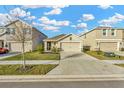 Two-story house with a two-car garage and front yard at 1663 Hazy Sea Dr, Plant City, FL 33565
