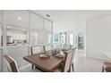 Open concept dining room with view into living room at 2407 Warren Acres Blvd, Wesley Chapel, FL 33543