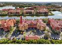 Aerial view highlighting condo building and parking at 2733 Via Cipriani # 830A, Clearwater, FL 33764