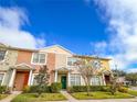 Front view of townhome with well-maintained landscaping at 30405 Elderwood Dr, Wesley Chapel, FL 33543