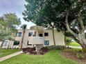 Condo building exterior showcasing landscaping and entrance at 5642 Puerta Del Sol S Blvd # 242, St Petersburg, FL 33715