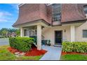 Condo entrance with stairs and well-maintained landscaping at 7020 Cognac Dr # 3, New Port Richey, FL 34653