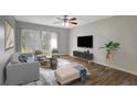 Spacious living room featuring wood-look floors and modern furnishings at 7020 Cognac Dr # 3, New Port Richey, FL 34653