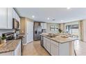 Modern kitchen featuring granite countertops and stainless steel appliances at 35182 Valley Ridge Rd, Dade City, FL 33525