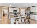 Modern kitchen island with granite countertop and breakfast bar seating at 35188 Valley Ridge Rd, Dade City, FL 33525