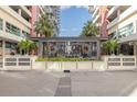 Modern building entrance with a sleek glass enclosure and landscaping at 1120 E Kennedy Blvd # 1221, Tampa, FL 33602
