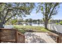 Spacious backyard with lake view and patio at 12506 Forest Hills Dr, Tampa, FL 33612