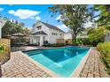 Relaxing rectangular pool with brick patio and outdoor seating area at 2220 12Th N St, St Petersburg, FL 33704