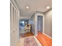 Bright foyer with hardwood floors and access to living areas at 703 Elkhorn Rd, Sun City Center, FL 33573