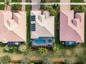 Bird's-eye view of house with pool and solar panels at 5006 Ruby Flats Dr, Wimauma, FL 33598