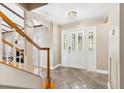 Bright entry hall with staircase and tile floors at 6006 Soaring Ave, Temple Terrace, FL 33617