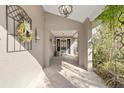 Front entry with covered walkway and tile flooring at 6006 Soaring Ave, Temple Terrace, FL 33617