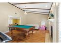 Game room featuring a pool table and fireplace at 6006 Soaring Ave, Temple Terrace, FL 33617