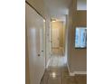 Hallway with tile floors and access to other rooms at 6232 Bayside Key Dr, Tampa, FL 33615