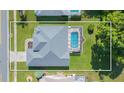 Bird's-eye view showing house, pool, and surrounding landscape at 10328 Henderson St, Spring Hill, FL 34608