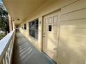 Clean condo hallway with an entrance to unit 30 at 2226 Switzerland Way # 30, Clearwater, FL 33763
