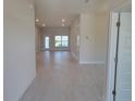 Bright and airy entryway with tile flooring that opens to a spacious living area at 36179 Welsh Glade Rd, Dade City, FL 33525