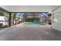 Screened-in pool area with a spacious concrete deck at 601 42Nd Ne Ave, St Petersburg, FL 33703