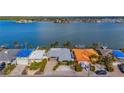 Aerial view of waterfront home and neighborhood at 16101 6Th E St, Redington Beach, FL 33708