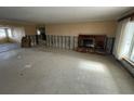 Spacious living room with fireplace and large windows at 11365 8Th E St, Treasure Island, FL 33706