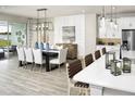Bright dining area with large table and access to pool at 12458 49Th E St, Parrish, FL 34219