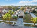 Aerial view of a house and surrounding neighborhood at 18052 Java Isle Dr, Tampa, FL 33647