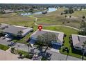 Aerial view showcasing home's location in a peaceful golf course community at 2407 Locksley St # 224, Sun City Center, FL 33573