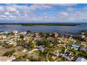 An aerial view showcases a single-Gathering home, a private pool, and a large backyard at 5801 Venetian Ne Blvd, St Petersburg, FL 33703