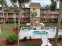 Community pool and spa with surrounding landscaping at 12760 Indian Rocks Rd # 562, Largo, FL 33774