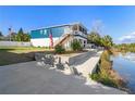 Two story waterfront home with canal views at 3276 Sea Grape Dr, Hernando Beach, FL 34607