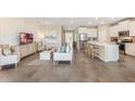 Open floor plan with modern kitchen and spacious living area at 6758 Broad River Ave, Land O Lakes, FL 34638