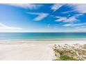 Expansive beach view, showcasing white sand and turquoise water at 20040 Gulf Blvd # 605, Indian Shores, FL 33785