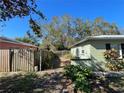 Side yard view showing wooden fence and walkway at 2221 York S St, Gulfport, FL 33707