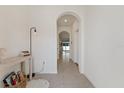 Bright and airy entryway with tile flooring and neutral walls at 2920 Evergreen Elm Pass, Wesley Chapel, FL 33543