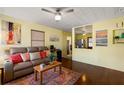 Cozy living room features hardwood floors, a comfortable sofa, and tasteful decor at 538 Southwest N Blvd, St Petersburg, FL 33703