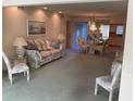 Open living and dining area with carpeted floor and furniture at 2255 Philippine Dr # 35, Clearwater, FL 33763